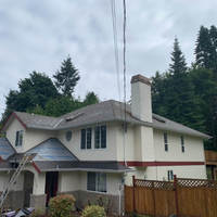 new roof under construction on large home